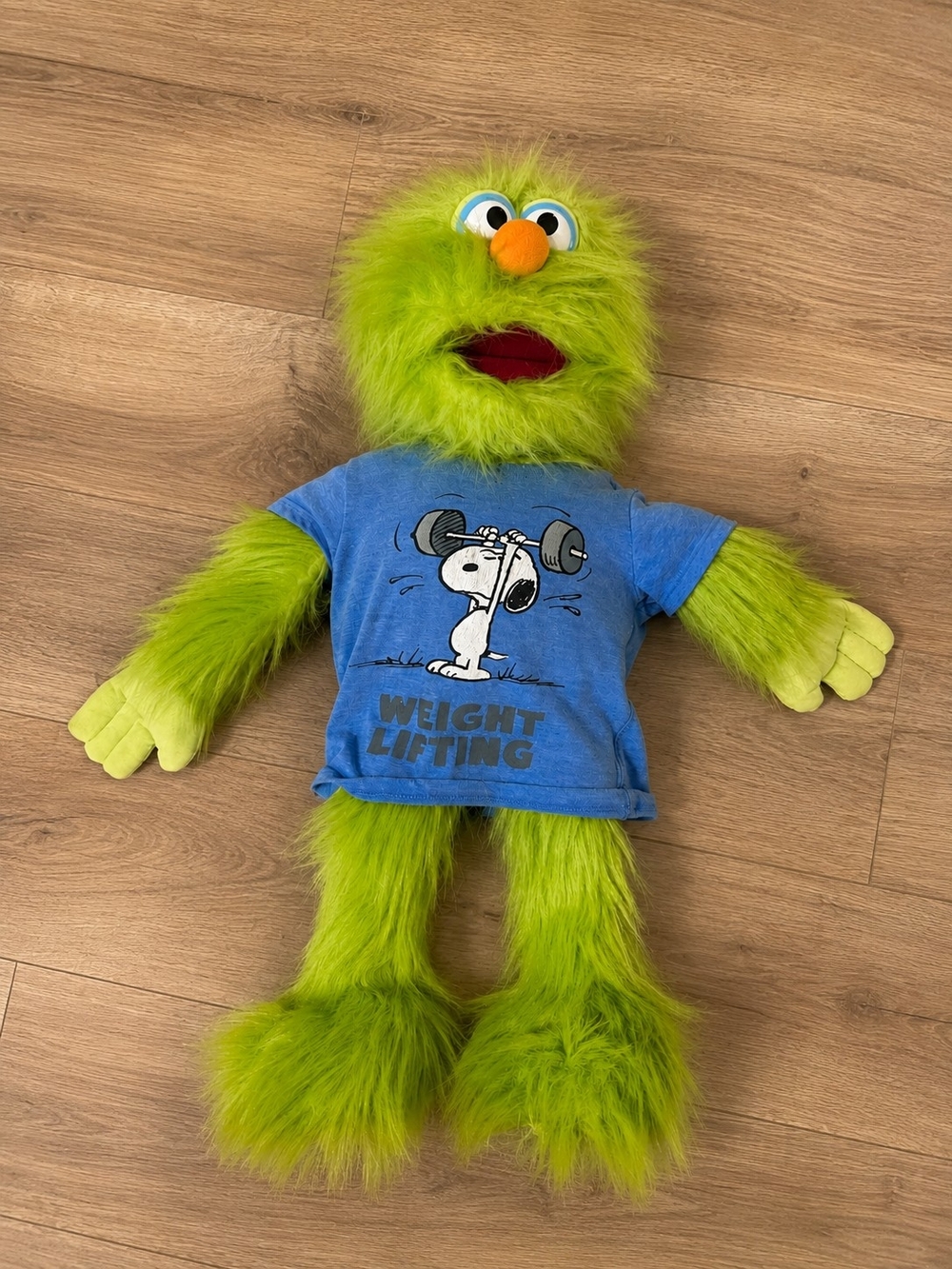 Green Plush Bird Toy with Blue Weight-Lifting Shirt